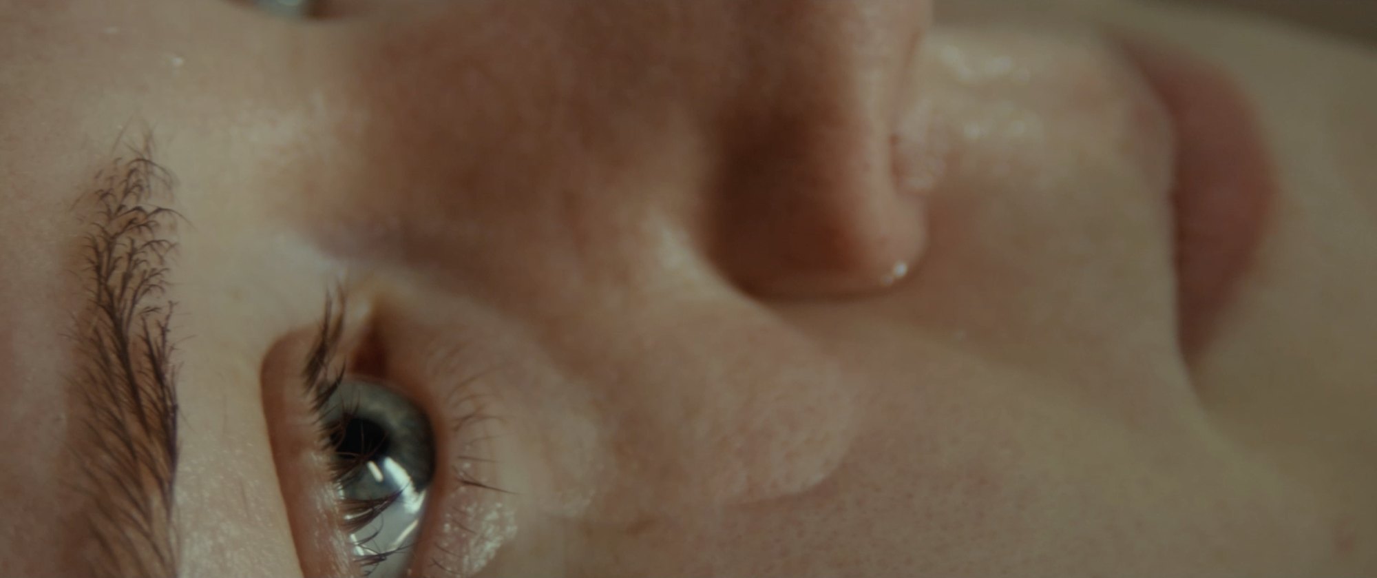 Film still: extreme close-up of a face and eye